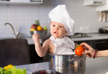  little boy, white chef hat, vegetables