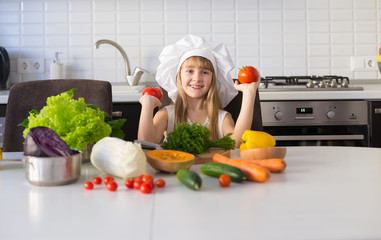  little girl, white chef hat, vegetables
