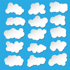 Vector set of abstract paper clouds on blue background.