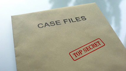 Case files top secret, seal stamped on folder with important documents, close up