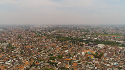 Aerial cityscape densely built asian city. modern city Surabaya with buildings and houses. Surabaya capital city east java, indonesia