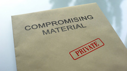 Compromising material private, seal stamped on folder with documents, close up