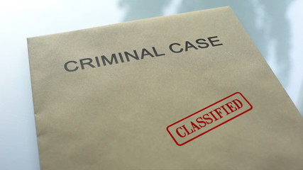 Criminal case classified, seal stamped on folder with police important documents