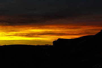 Obraz premium Sunset on the rocks of the river canyon paintings in Santa Cruz, Argentina. 10000 years ago in this place, the native culture painted the famous archaeological site of the 