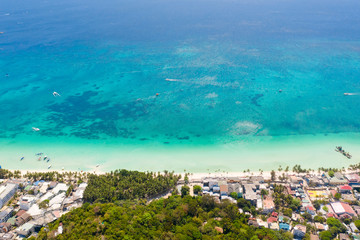 Houses and streets on the island of Boracay, Philippines, top view. Hotels and buildings on the big island. Landscape on a sunny day.