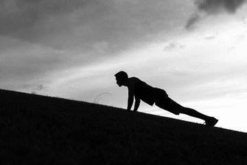 Man doing pushup exercise outdoors
