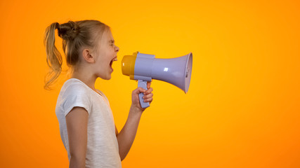 Anxious teen girl shouting in loudspeaker, relieving stress, children rights