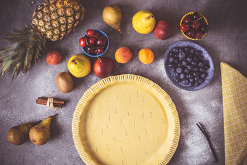 Preparation of Fruit Pie with Colorful Fruits and Fresh Dough Ready to Bake