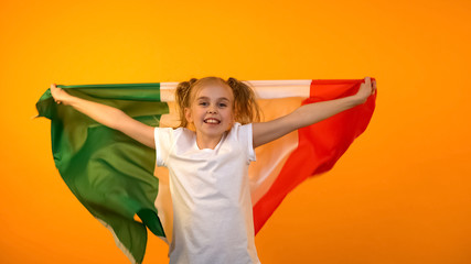 Joyful girl waving italian flag, supporting national sport team, football game