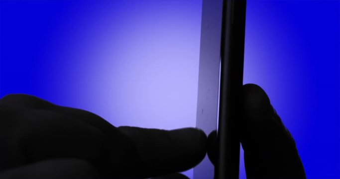 An anonymous person using a smartphone for trolling or privacy reasons