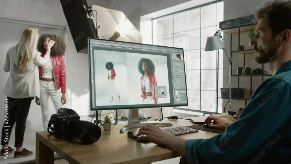 Poster backstage of the photoshoot: make-up artist applies makeup on beautiful black girl. photo editor wor