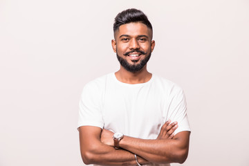 Indian young man standing with hands folded against white background