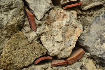 potted fragments in a stone wall