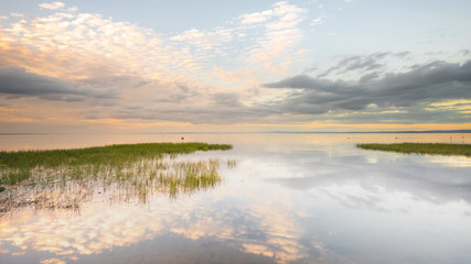Reflections on the becalmed waters of Lough Neagh, County Armagh, Northern Ireland 