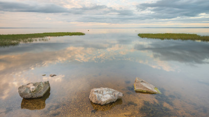 Reflections on the becalmed waters of Lough Neagh, County Armagh, Northern Ireland 