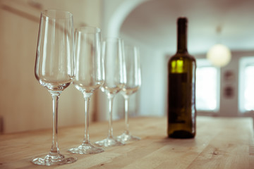 row of wine glasses on bar