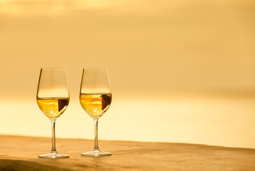 Pair of wingless on a ocean sunset background  