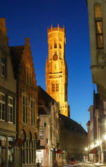Belfry of Bruges and night street Bruges, Flemish Region, Belgium