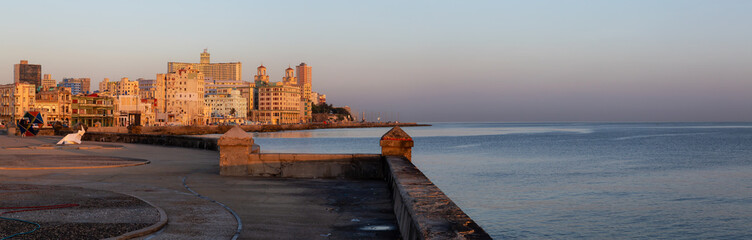 Beautiful panoramic view of the Old Havana City, Capital of Cuba, by the Ocean Coast during a vibrant sunny sunrise.