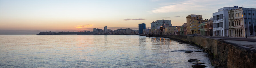 Beautiful panoramic view of the Old Havana City, Capital of Cuba, by the Ocean Coast during a vibrant sunny sunrise.