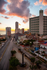 Fototapeta na wymiar Aerial view of the Havana City, Capital of Cuba, during a colorful cloudy sunrise.
