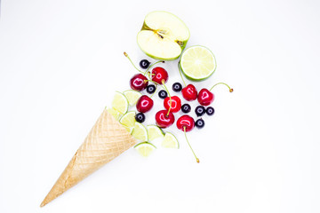 Creative layout of fresh fruits, nuts and ice cream cone. Flat lay. Summer concept.