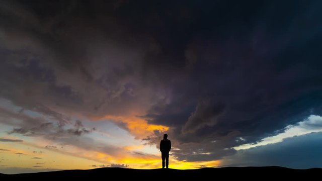The silhouette of man on the cloud stream background
