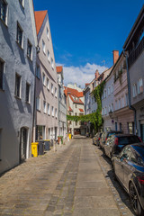 Fototapeta na wymiar AUGSBURG, GERMANY - SEPTEMBER 16, 2016: Narrow alley in the old town of Augsburg