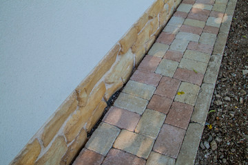 Detail of a narrow path made of bricks