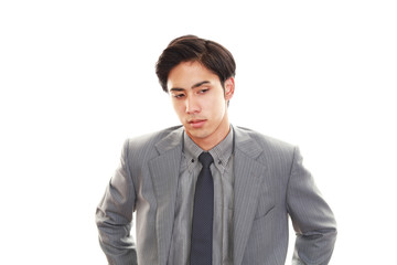 疲れた表情のビジネスマン