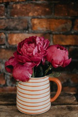 A bouquet of deep pink peonies