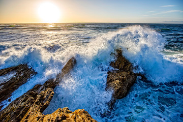 Waves Crashing into Rocks at Beach and Ocean