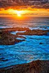 Sunset over the Sea and Rocky Coast