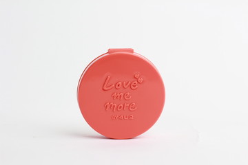 Cream blusher for women. Small compact beauty product.