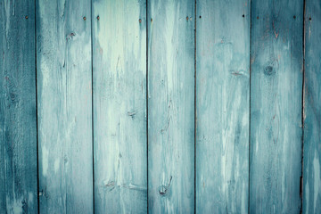 Painted turquoise wooden background; weathered wooden wall, horizontal