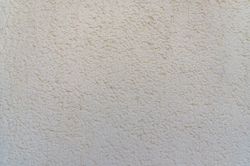 Rough bumpy white concrete plaster texture background.