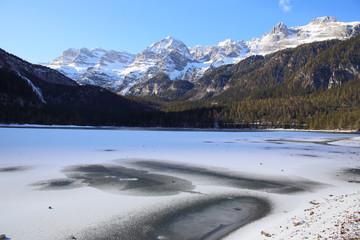  frozen alpine Lake Tovel of Dolomites, Italy