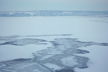 winter season , frozen lake ice background 