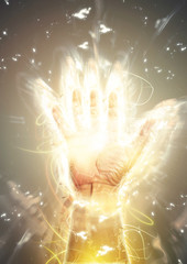 光り輝く手