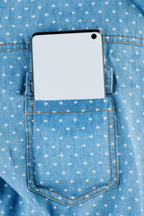 Modern smartphone in shirt pocket