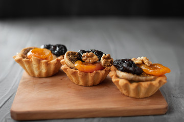 delicious cupcakes laid out in a row. healthy diet. dessert with dried apricots and prunes