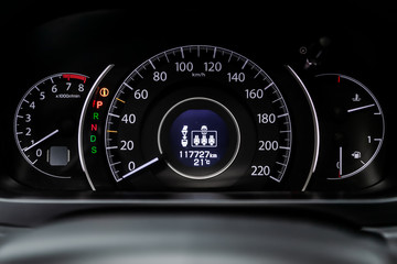 Car dashboard wuth red backlight: Odometer, speedometer, tachometer, fuel level, water temperature...