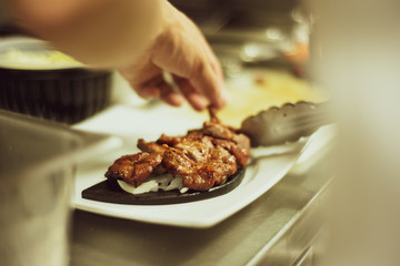 The chef is preparing food in the kitchen