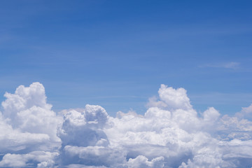 Beautiful scenery of sky and white clouds looking from window on airplane. Space for text