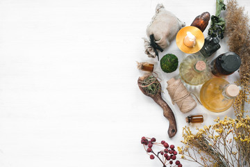 Witch doctor concept. Witchcraft background with copy space. Dried herbs and liquids in a bottles...