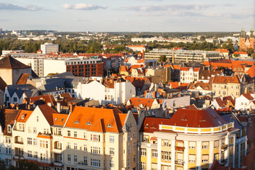 Fototapeta na wymiar Poznan, Poland - August 30, 2016: View on old and modern buildings at sunset in town Poznan