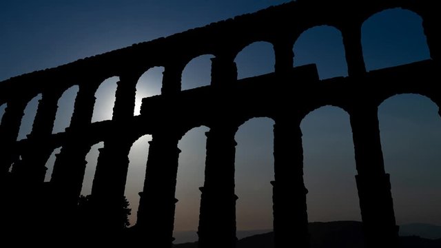 Segovia: Ancient Roman aqueduct at Sunset ,World Heritage Site of UNESCO, Spain, Europe