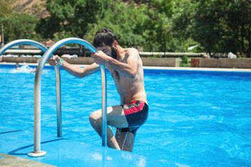 Caucasian man in the swimming pool.