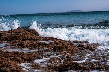 waves crashing on rocks
