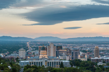 View of the Utah State Capitol Building and downtown skyline at sunset, in Salt Lake City, Utah